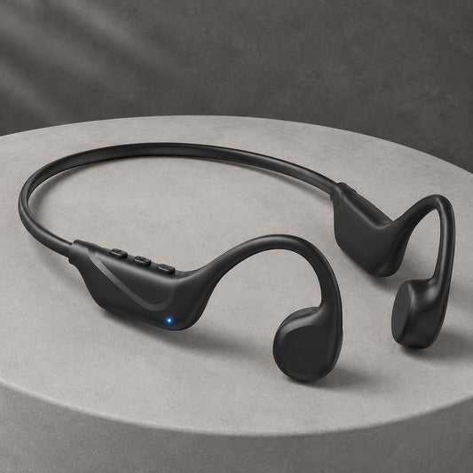Windryft Aero open-ear bone conduction headphones in black, resting on a stone pedestal, showing the flexible titanium neckband and the two driver pads